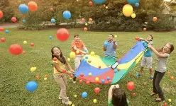 Childern Throwing balls in the air
